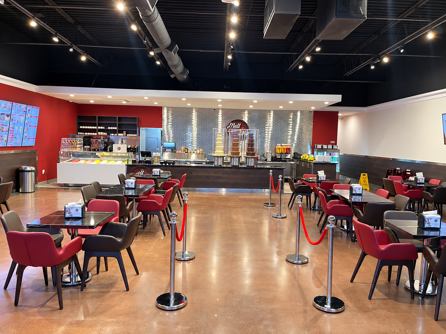 Melt n Dip interior with service counter, seating and ceiling lighting